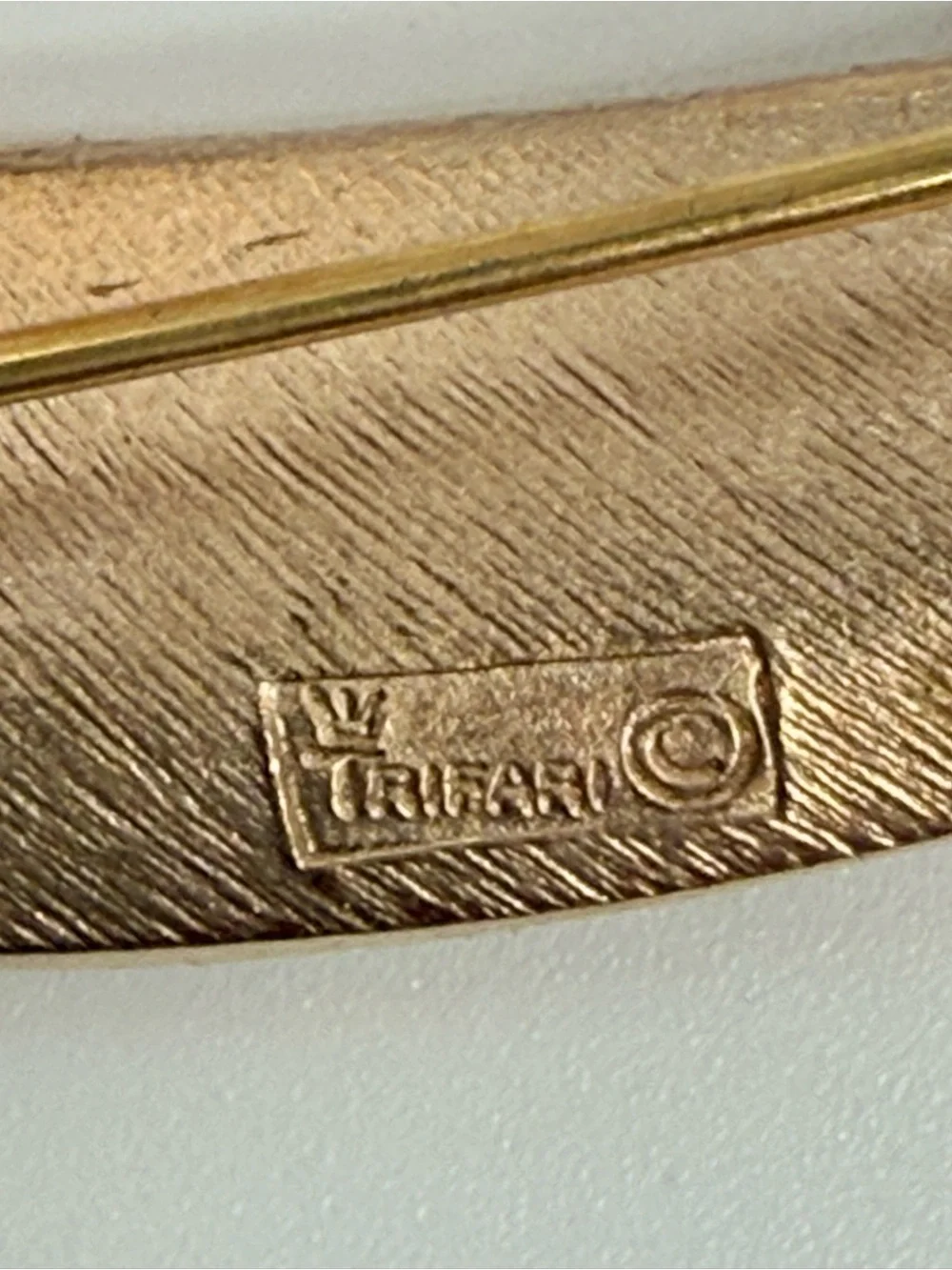 vintage Crown Trifari gold tone split leaf brooch from the 1960s.